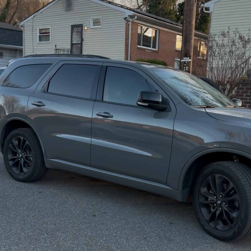 Gray SUV after tint with matching dark side and rear glass